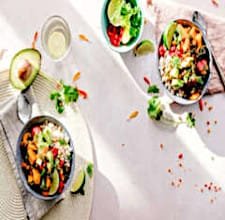 A variety of colorful healthy meals served on a wooden table.