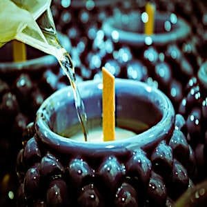 A beautifully crafted candle in a blue ceramic cup, perfect for gifting or self-care.