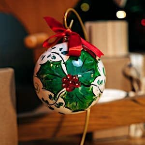 Handmade Christmas ball with red ribbon.