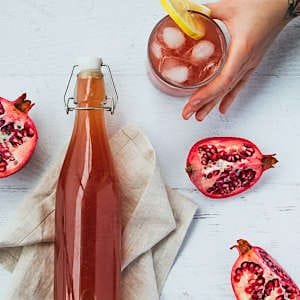 A glass bottle filled with homemade alcohol, carefully crafted and sealed for gifting or personal enjoyment.