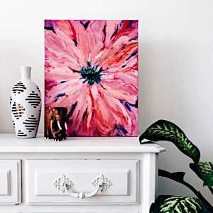A beautifully crafted handmade painting of a delicate pink flower.